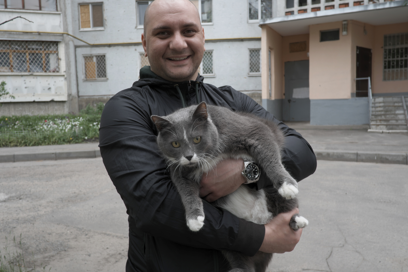 A man with a cat